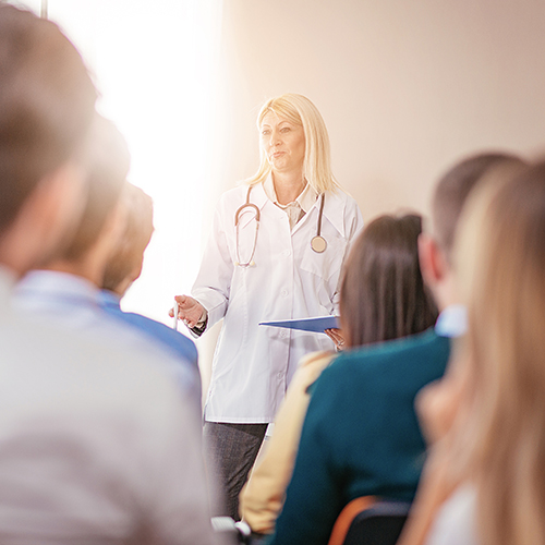 Image of nurse giving a conference presentation